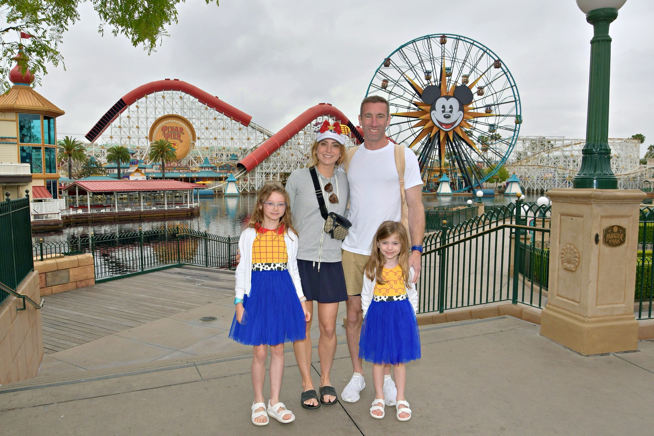 Grant and Kristen with their two daughters at Pixar Pier in Disney California Adventure